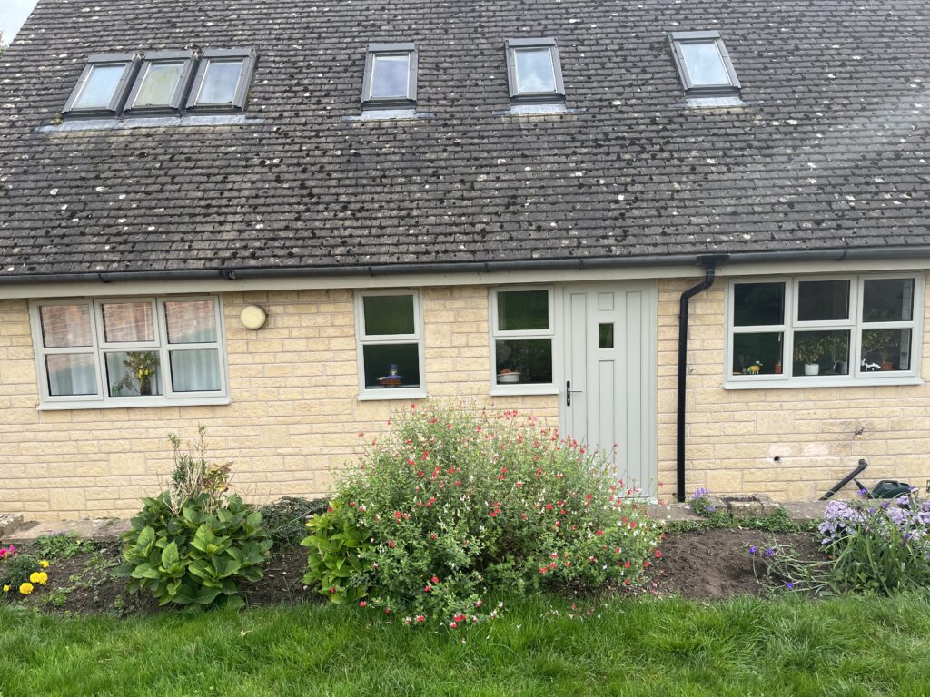 Back of the house, New windows and door, Garden, Silent Sunday, My Sunday Photo, A house made of light coloured brick with green-grey windowframes