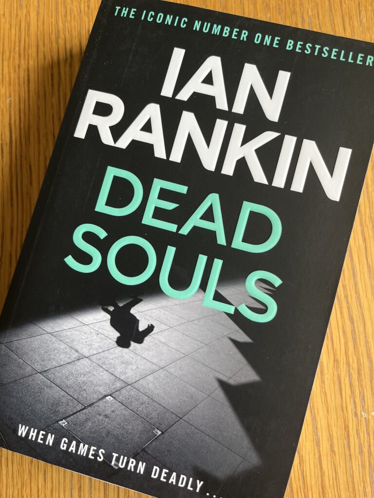 Dead Souls by Ian Rankin, Dead Souls, Ian Rankin, Book review, A black book entitled Dead Souls by Ian Rankin sits on a wooden table