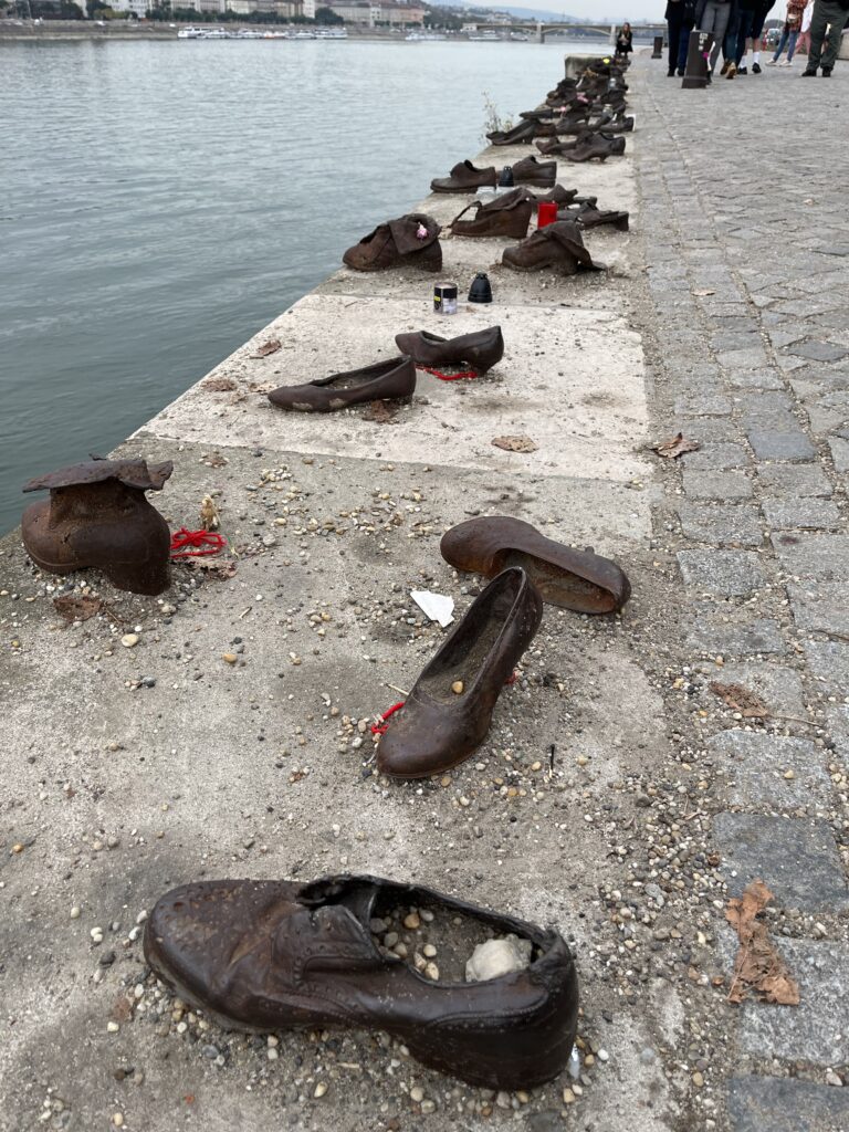 Shoes on the Danube Bank, Sculpture, Memorial, Budapest, Hungary, Danube, Shoes made of bronze stretch into the distance on a concrete river bank
