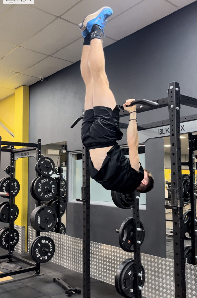 Son, Gym, Adult son, Young adult, A young man in black shorts and top with blue trainers hangs upside down from bars in the gym, Silent Sunday, My Sunday Photo