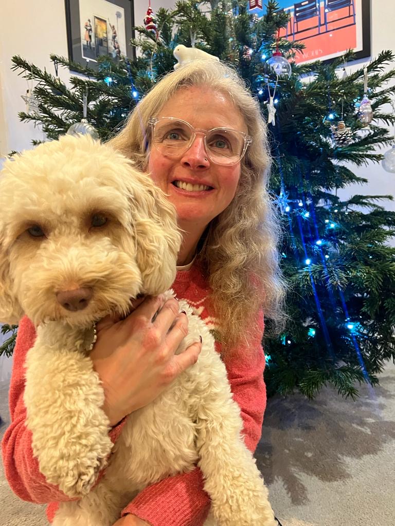 Cockapoo, Hetty, Christmas tree, A woman with long hair and glasses sits by a Christmas tree holding a cockapoo dog, My Sunday Photo, Silent Sunday