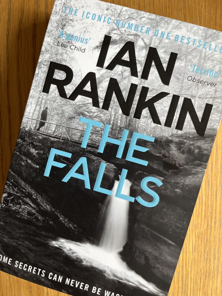 The Falls by Ian Rankin, The Falls, Ian Rankin, Book review, A book called The Falls by Ian Rankin sits on a wooden table