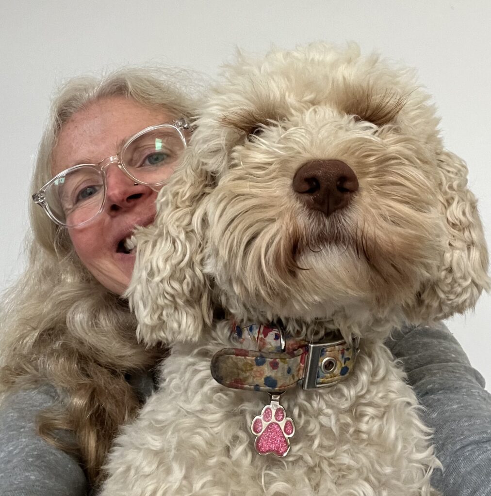 Hetty, Dog, Cockapoo, Close up of a golden cockapoo dog with a smiling woman wearing glasses behind her