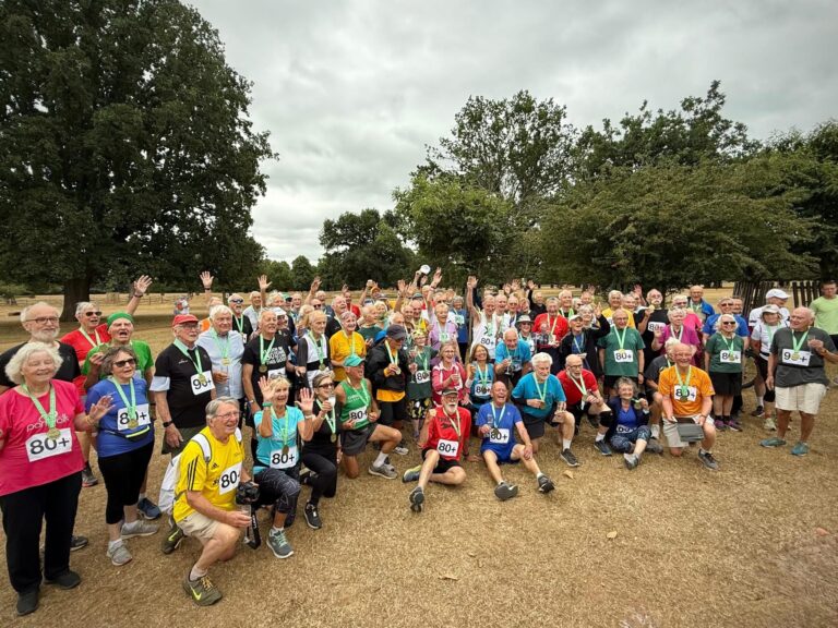 Bushy parkrun, Bushy Park, Octogenarian parkrun, A large group of smiling older runners all wearing medals and with 80+ on the front