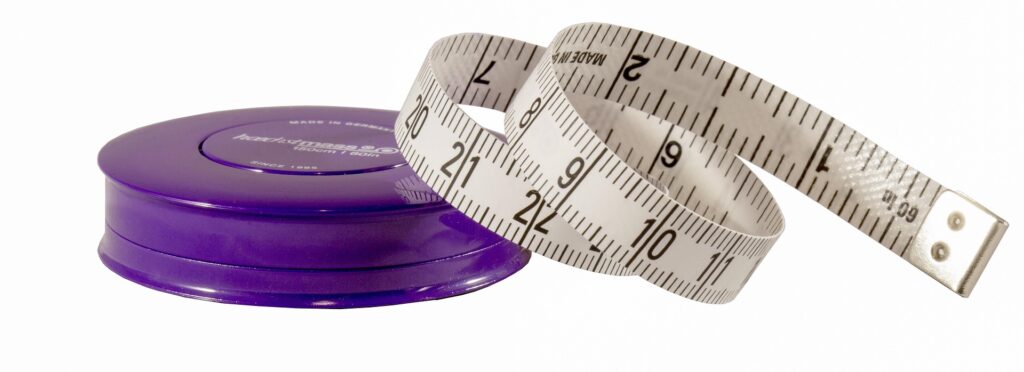 Tape measure, Measuring, Home, A white tape measure curls out of a round purple container