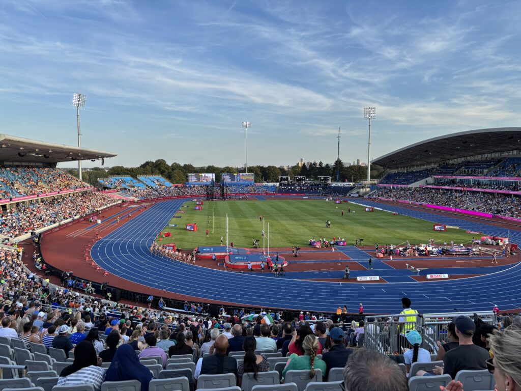 European Athletics Championships, Alexandra Stadium, Birmingham, Silent Sunday, My Sunday Photo, An athletic stadium with a blue track and people in stands against a blue sky